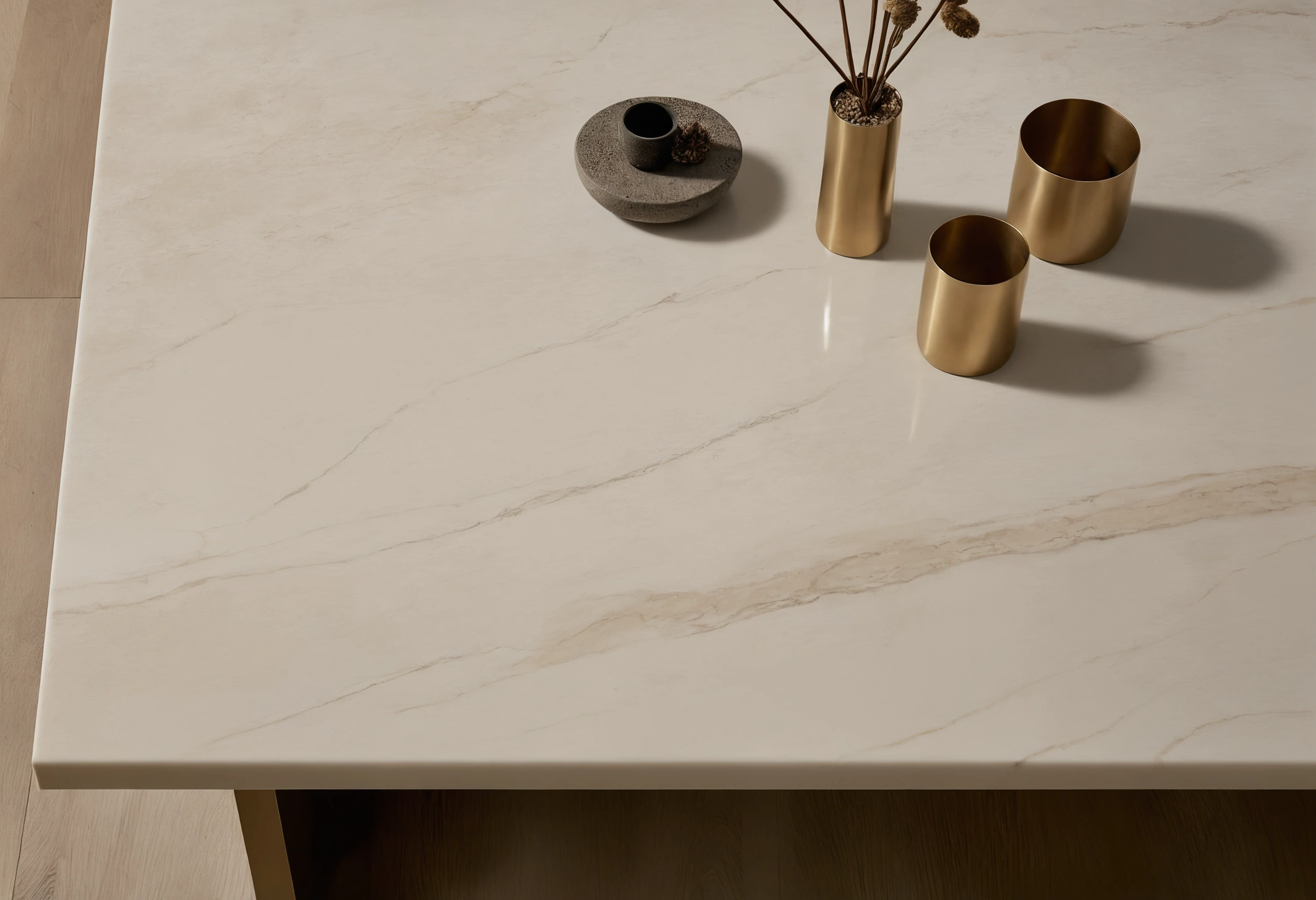 Two sofa fabric options laid side by side on a marble console with sample tiles and timber veneers